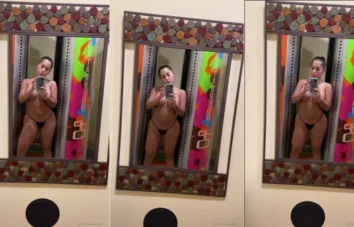 Angela Grajales, uma morena cheia de curvas, se exibindo de maneira sensual no espelho