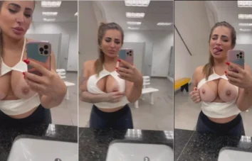 Kelly Valim se exibindo na academia, destacando seus peitões no espelho